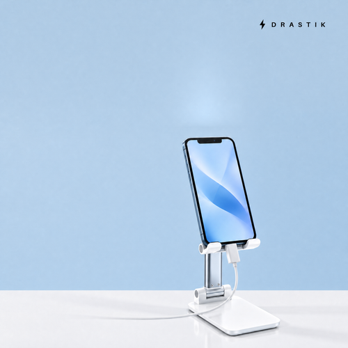 Adjustable Phone Stand in white holding a phone on a desk